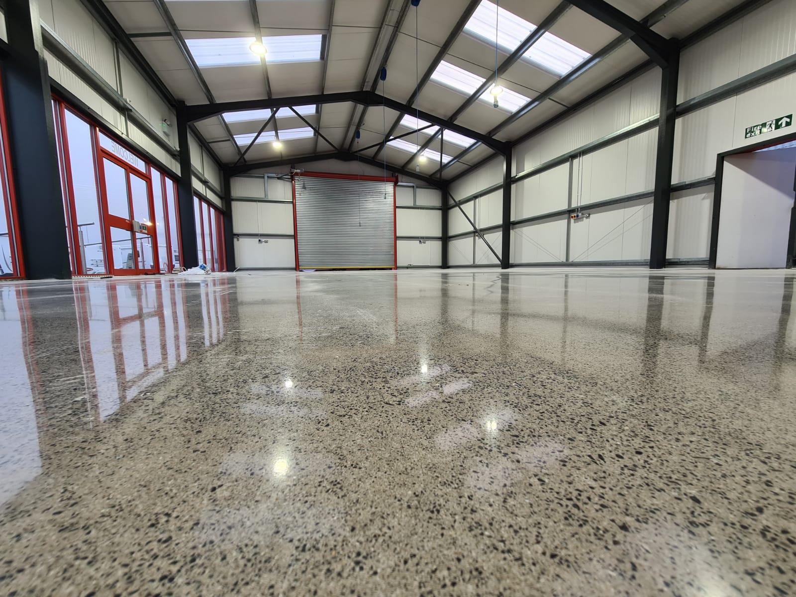 a warehouse with a polished concrete floor